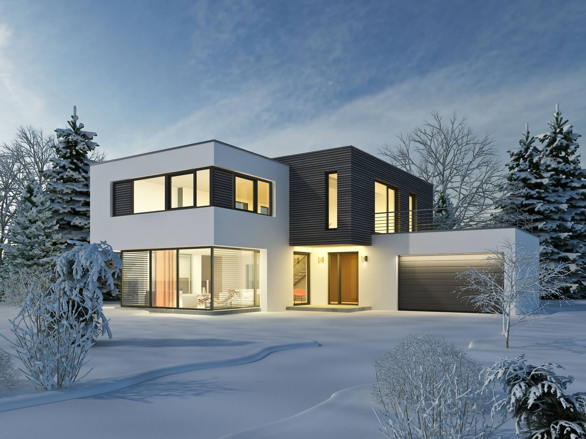 Modernes Einfamilienhaus schneebedeckt im Winter